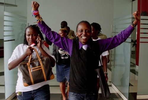 Gay rights activists react as the constitutional court overturns anti-gay laws in Uganda. Credit Isaac Kasamani/Agence France-Presse — Getty Images.